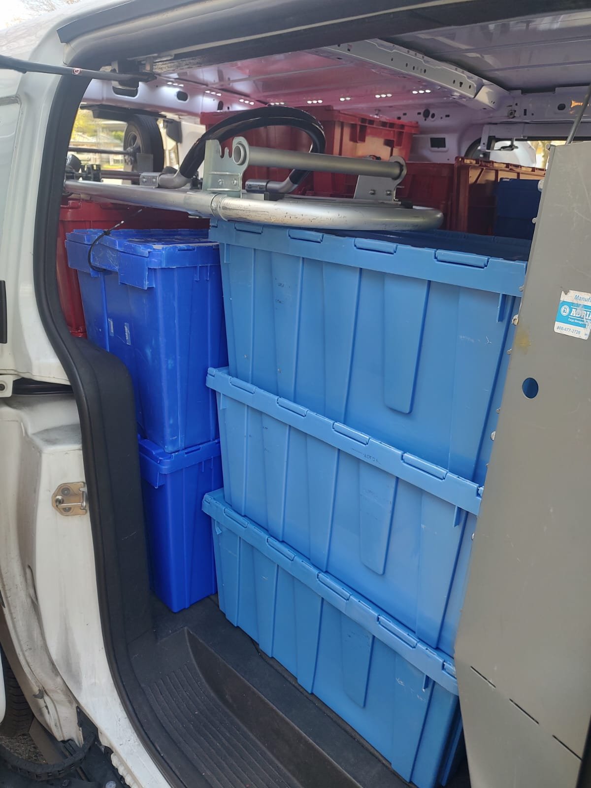 Santini delivery crates organized inside van