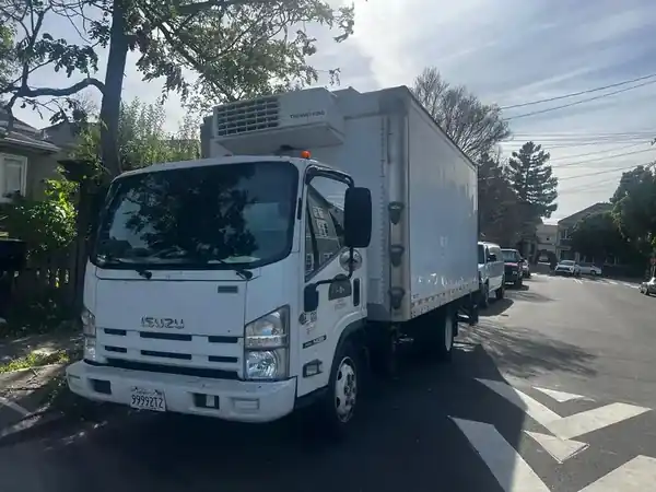 Santini Delivery Solutions Isuzu commercial truck on California street