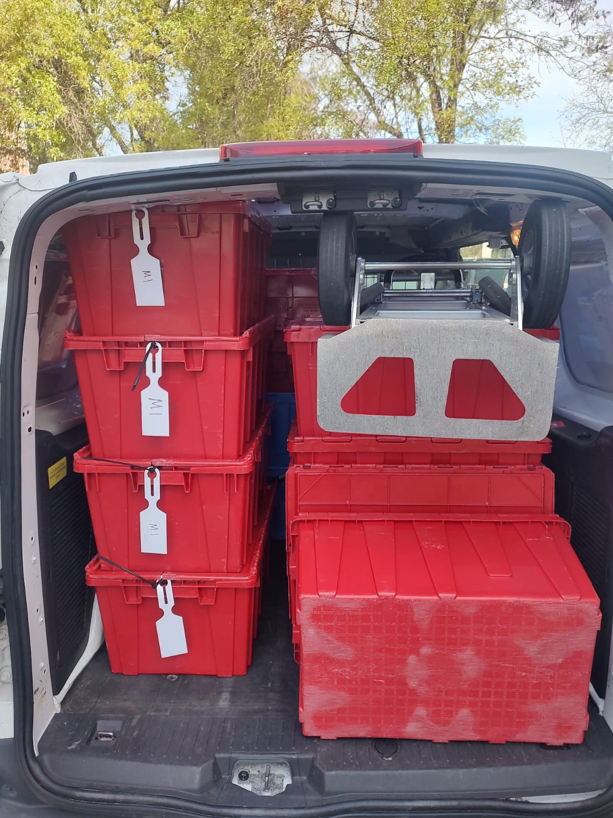 Santini delivery crates organized and tagged for retail delivery